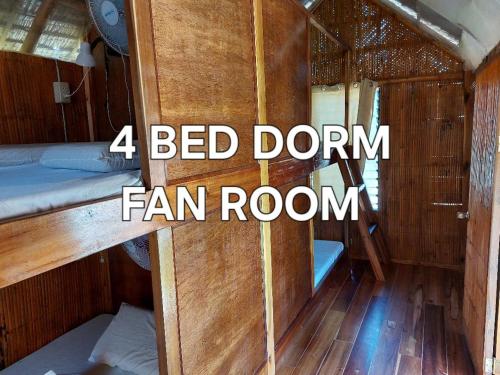 a bedrum fan room in a boat with the words bed dorm fam room at Russell Place in San Vicente