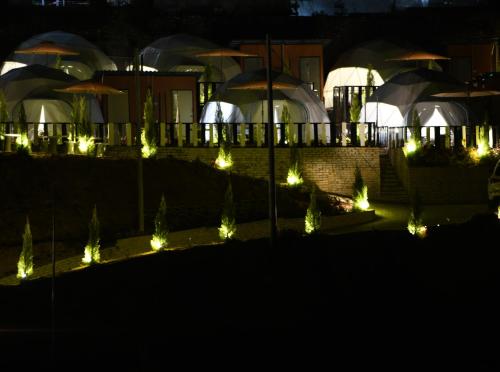 a garden with lights in front of a building at Gold Crest Cameron Highlands in Tanah Rata