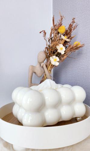 a white vase with a figurine on top of a bowl at Penang Georgetown 3BRCPGF The Martian #TvBox in Jelutong