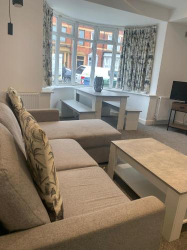 a living room with a couch and a table at Cleadon in Goole