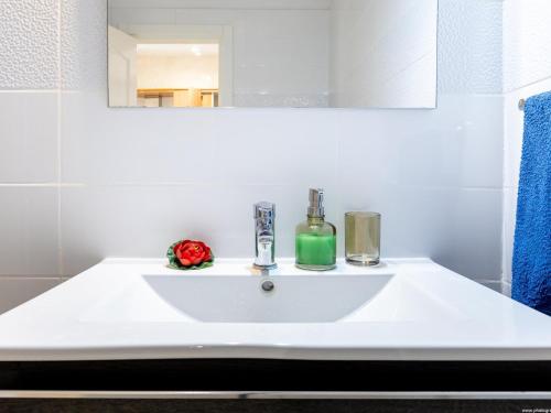 a white sink in a bathroom with a mirror at Port Royale 291, Spacious Studio in Los Cristianos