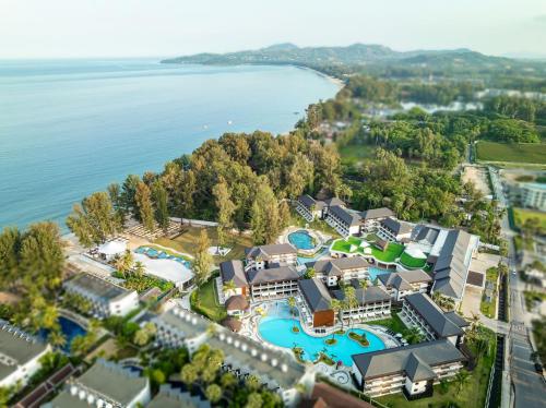 an aerial view of the resort with the waterpark at Amora Beach Resort Phuket in Bang Tao Beach