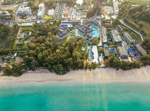 an aerial view of a resort on the beach at Amora Beach Resort Phuket - SHA Extra Plus in Bang Tao Beach