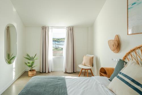 Ένα ή περισσότερα κρεβάτια σε δωμάτιο στο Villas de La Ribera