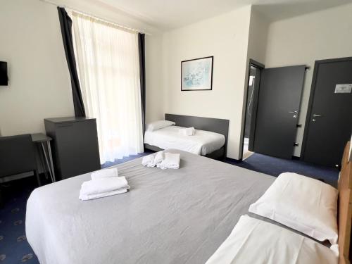 Ένα ή περισσότερα κρεβάτια σε δωμάτιο στο Hotel Regina del Bosco