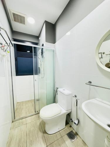 a bathroom with a toilet and a shower and a sink at CoreSoho Suite by BKAstaycation KotaWarisan Sepang KLIA Airport, Free Wifi in Sepang