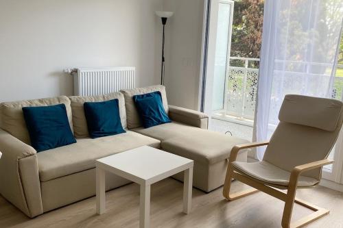 a living room with a couch and a chair at Flat Bobigny near Paris 1 min from the metro in Bobigny