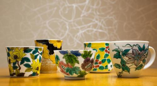 a group of four cups sitting on a table at Hotel Resol Trinity Kanazawa in Kanazawa