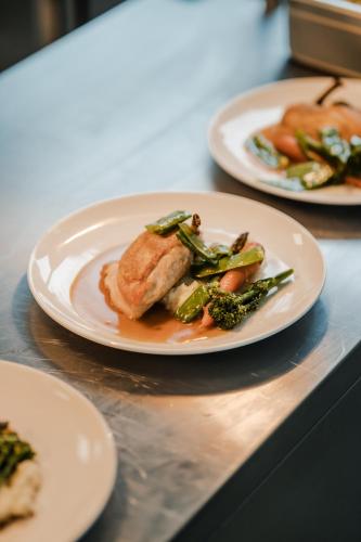 a table with three plates of food on it at NOI Resort SPA - woda i las in Tęgoborze
