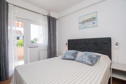 Posteľ alebo postele v izbe v ubytovaní Apartment TODOR