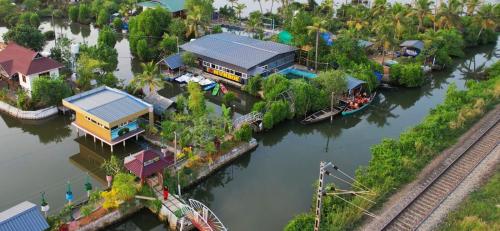 an aerial view of a house next to a river at Bell Farms and Resorts in Munroe Island