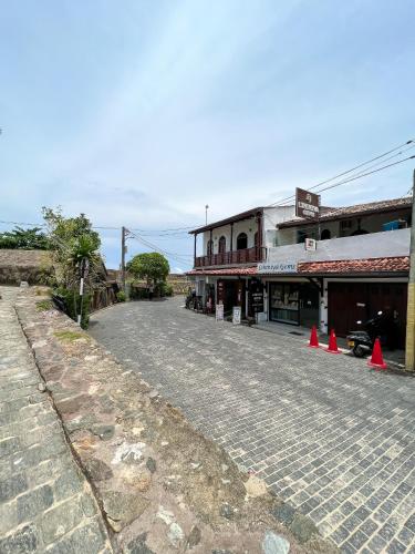 an empty street with orange cones in front of a building at Light House View Inn - Galle Fort in Galle