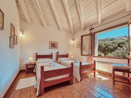 Postelja oz. postelje v sobi nastanitve Beach Home Baja Sardinia