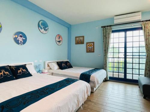 Postel nebo postele na pokoji v ubytování 關山稻香田園民宿