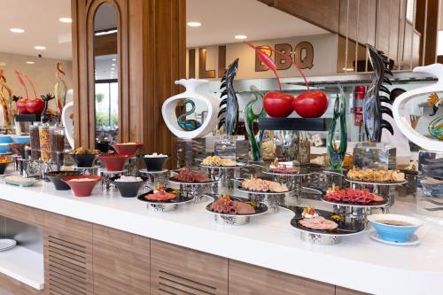 a buffet line with appetizers and desserts on it at Belenli Resort Hotel in Belek
