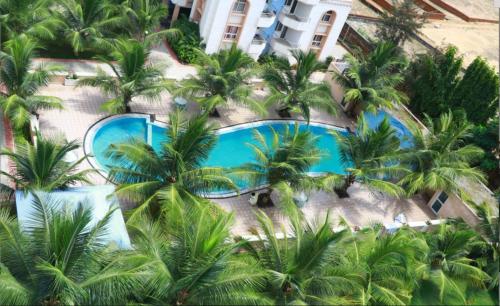 an aerial view of a resort with palm trees at Liberty Resort in Puri