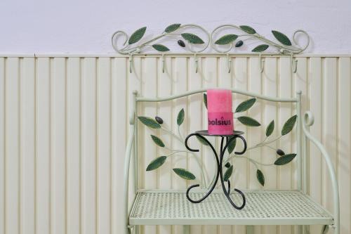 a shelf with a pink cup on top of it at Mare Etrusco 4 in Populonia