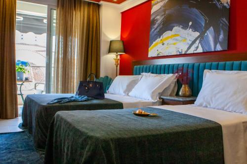 Postel nebo postele na pokoji v ubytování Art Hotel Aronos