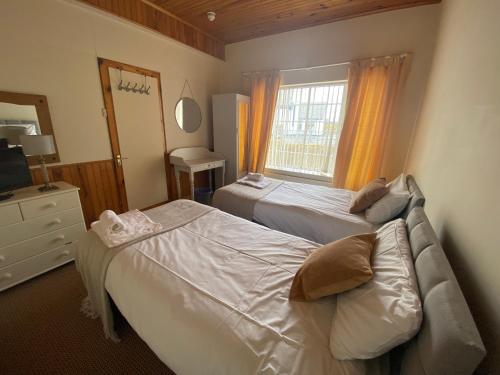Ліжко або ліжка в номері 8 Croaghross House, Portsalon
