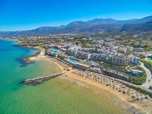an aerial view of a resort on the beach at Alexander Beach Hotel & Village Resort in Malia