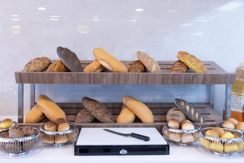 a bunch of different types of bread and pastries at Belenli Resort Hotel in Belek