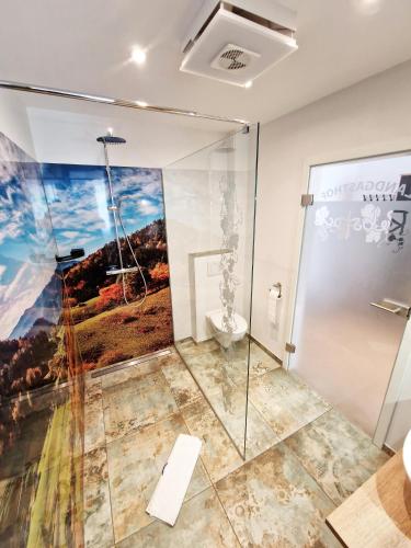 a bathroom with a painting on the wall at Landgasthof Rebstock in Ottenhöfen