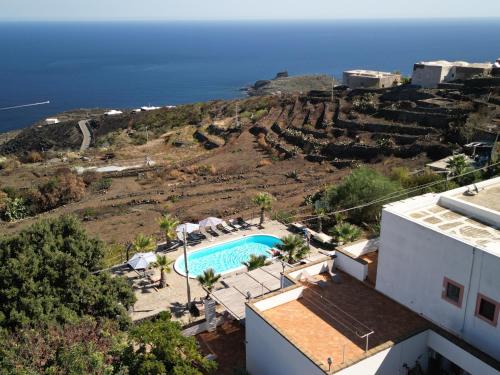 an external view of a villa with a swimming pool at Villa Alba Appartamenti in Kamma