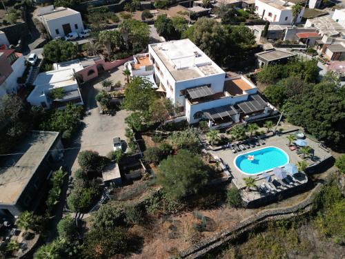 an aerial view of a house with a swimming pool at Villa Alba Appartamenti in Kamma