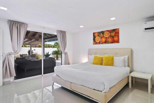 Ένα ή περισσότερα κρεβάτια σε δωμάτιο στο Villa Marquesa Aruba