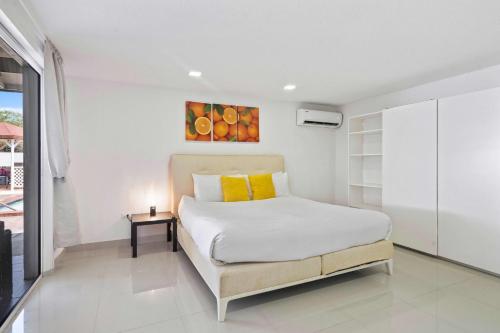 Ένα ή περισσότερα κρεβάτια σε δωμάτιο στο Villa Marquesa Aruba