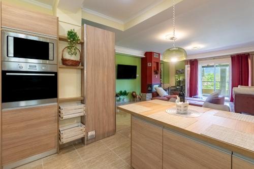 a kitchen with a large island with a counter top at Casa D' Irene in Ágios Matthaíos