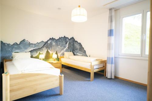 Una cama o camas en una habitación de Chasa La Plavna Willeke