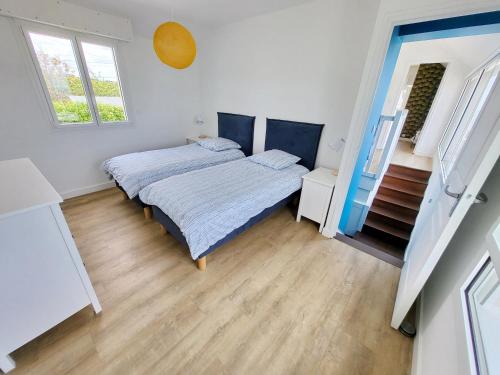 Postel nebo postele na pokoji v ubytování 713-Villa du Roz-Grand confort