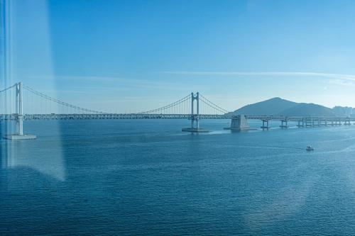 a bridge over a large body of water at H Avenue Hotel Gwangalli branch in Busan