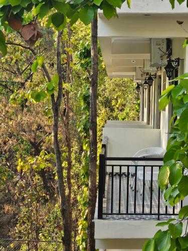 a balcony of a house with a bench on it at Marten's Wilderness Retreat in Lansdowne