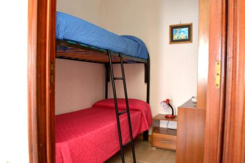 En eller flere senge i et værelse på Ll43 Casa vacanze Tanoshii