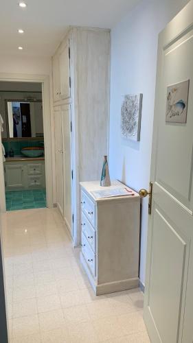 a kitchen with a dresser and a counter in a room at villa verde sul mare in Vietri sul Mare