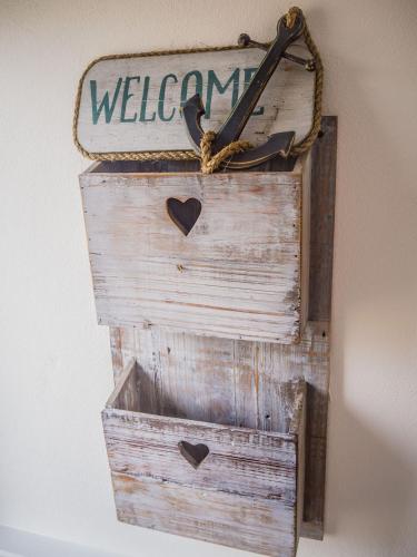 a wooden box with a sign that says welcome at 14 Leitirshask, Ballyconneely in Ballyconneely