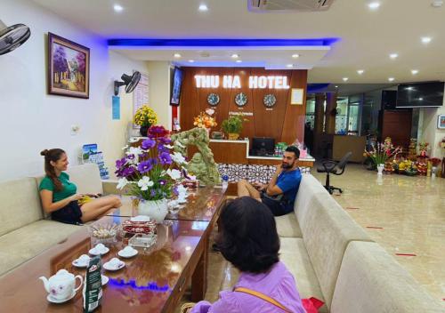 a group of people sitting in a hotel lobby at Thu Ha Hotel in Uông Bí