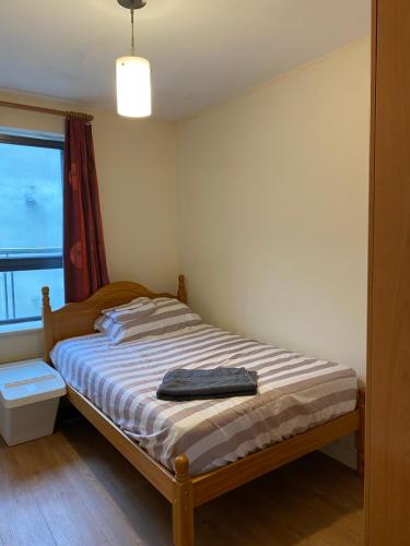 a bedroom with a bed with a blue towel on it at CamdenWharf in Cork