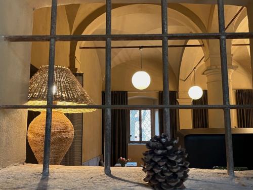 a view through a window of a room with a pineapple at B&B lo scudaio Palazzo Marchionneschi in Montescudaio