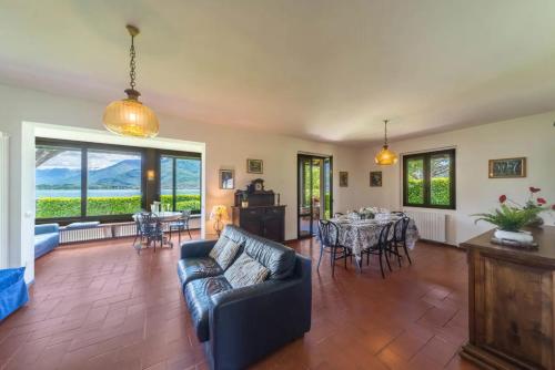 a living room with a couch and a table at Villa Rita in Domaso