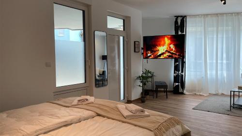 Postel nebo postele na pokoji v ubytování Gallery Apartment