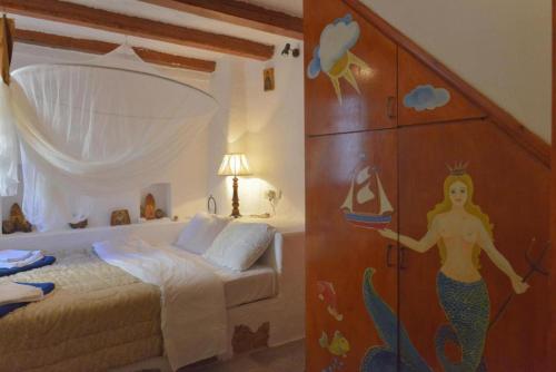 Ένα ή περισσότερα κρεβάτια σε δωμάτιο στο Elounda Collection Villa