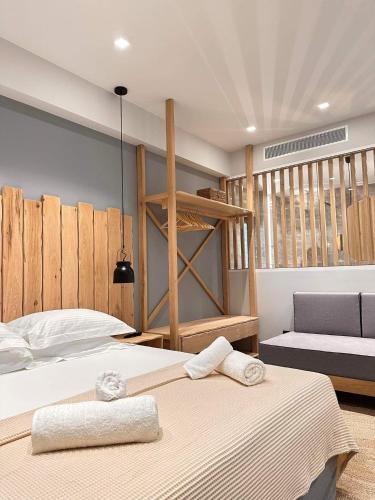 a bedroom with a bed with two towels on it at Muses in Kourouta