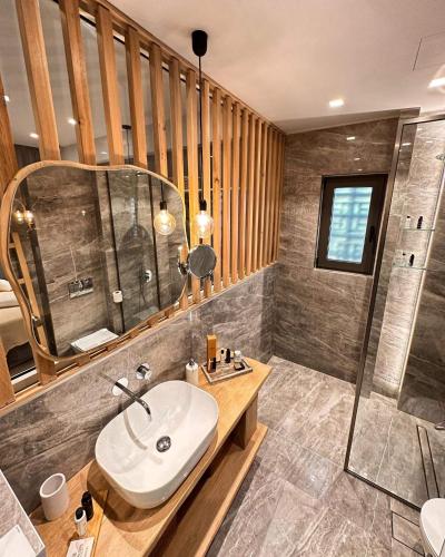a bathroom with a sink and a shower at Muses in Kourouta