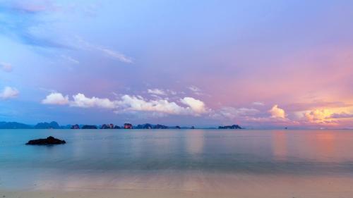 a view of the ocean with a cloudy sky at Six Senses Yao Noi in Ko Yao Noi