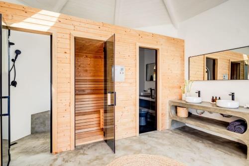 a bathroom with a shower and two sinks at Mountain View Villa in Cape Town