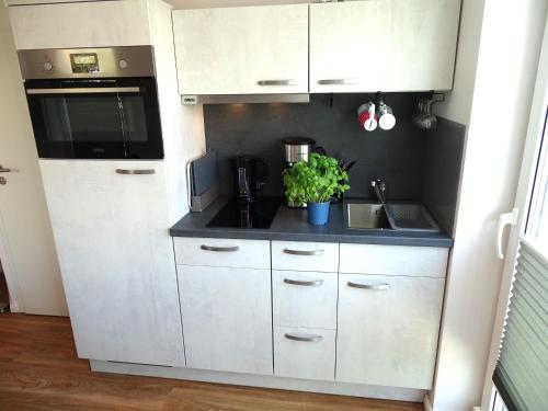 Kuchyň nebo kuchyňský kout v ubytování Lütt Plambeck-Appartement Inge DG 6