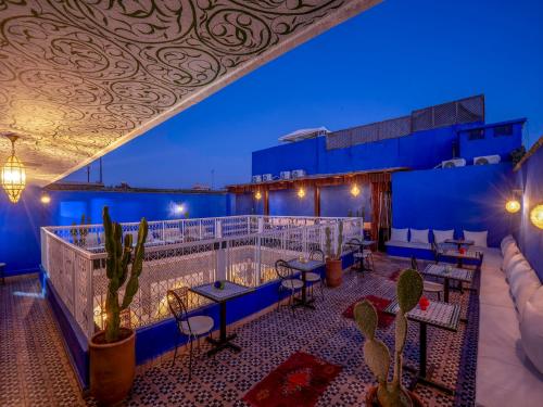 a view of the rooftop deck of a hotel at night at Riad Nuits D'orient Boutique Hotel & SPA in Marrakech